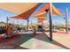 Community playground with colorful play equipment and shade structures at 3177 Bivona Walk, Henderson, NV 89044