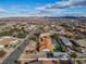 Expansive aerial view showcases a residential area, pool, and mountain backdrop at 321 E Middleton Dr, Henderson, NV 89015