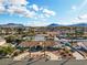 Panoramic aerial view of a neighborhood showcasing homes with desert landscaping and mountain views at 321 E Middleton Dr, Henderson, NV 89015