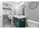 Modern bathroom featuring an integrated sink, black fixtures, and geometric tile flooring at 321 E Middleton Dr, Henderson, NV 89015