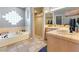 Bathroom featuring tub, vanity, and sink with tiled shower and flooring at 321 E Middleton Dr, Henderson, NV 89015