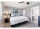 Relaxing bedroom featuring neutral decor and ceiling fan, with an ensuite bathroom at 321 E Middleton Dr, Henderson, NV 89015
