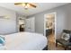 Inviting bedroom features neutral decor with a chair, providing a serene and relaxing space at 321 E Middleton Dr, Henderson, NV 89015