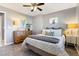 Charming bedroom provides a relaxing ambiance with stylish decor, including lamps, dresser, and a comfortable bed at 321 E Middleton Dr, Henderson, NV 89015