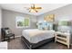 Bright bedroom featuring a large window, neutral walls, and comfortable seating area at 321 E Middleton Dr, Henderson, NV 89015