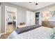 Cozy bedroom featuring neutral decor, with modern furnishings and an ensuite bathroom for added convenience at 321 E Middleton Dr, Henderson, NV 89015