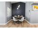 Modern dining area features a round table, stylish chairs, and a decorative accent wall at 321 E Middleton Dr, Henderson, NV 89015