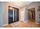 Entryway with herringbone floors and modern double front doors at 321 E Middleton Dr, Henderson, NV 89015