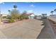 View of a home's garage with RV parking including a shaded awning and desert landscaping in the surrounding yard at 321 E Middleton Dr, Henderson, NV 89015