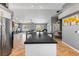 Open-concept kitchen and living area with a large island and modern appliances at 321 E Middleton Dr, Henderson, NV 89015
