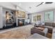 Cozy living room with a fireplace, stylish artwork, and comfortable seating arrangements at 321 E Middleton Dr, Henderson, NV 89015