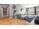 Open living room with gray walls, herringbone floors, and view to a pool and desert landscaping at 321 E Middleton Dr, Henderson, NV 89015