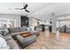 Bright and open living space connected to the kitchen, featuring a large sectional and modern lighting at 321 E Middleton Dr, Henderson, NV 89015