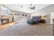 Spacious primary bedroom featuring a fireplace, ceiling fan, and private backyard at 321 E Middleton Dr, Henderson, NV 89015