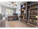 Charming home office featuring a custom built-in bookcase and a comfortable workspace at 321 E Middleton Dr, Henderson, NV 89015