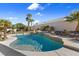 Inviting pool surrounded by lush tropical landscaping, providing a private oasis for relaxation and recreation at 321 E Middleton Dr, Henderson, NV 89015