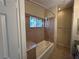 Tiled bathroom featuring a bathtub with shower, granite counter tops, and a decorative window at 3550 Bay Sands Dr # 3081, Laughlin, NV 89029