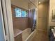 Bathroom featuring double sinks, granite counters, tub shower, and decorative glass window at 3550 Bay Sands Dr # 3081, Laughlin, NV 89029