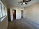 Bedroom with carpet, ceiling fan, window with blinds, and ensuite access at 3550 Bay Sands Dr # 3081, Laughlin, NV 89029
