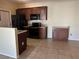Kitchen with brown cabinets and tile flooring at 3550 Bay Sands Dr # 3081, Laughlin, NV 89029