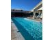 Community pool with clear blue water, comfortable seating, and mountain views at 3550 Bay Sands Dr # 3081, Laughlin, NV 89029