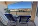 Balcony featuring seating with mountain views in the distance and black metal railing at 3821 S Tumbleweed Ave, Pahrump, NV 89048