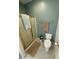Bright bathroom featuring a glass shower and neutral colored walls and flooring with a toilet at 3821 S Tumbleweed Ave, Pahrump, NV 89048
