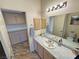 Updated bathroom with a vanity, large mirror, and decorative tile counters at 3821 S Tumbleweed Ave, Pahrump, NV 89048