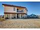 Two-story home with a large balcony, mature landscaping, and space for parking at 3821 S Tumbleweed Ave, Pahrump, NV 89048