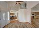 Open foyer with hardwood floors leading to the living areas and front entry door at 3821 S Tumbleweed Ave, Pahrump, NV 89048
