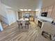 Beautiful kitchen with island, stainless steel appliances, eat-in bar, and an abundance of counter space and wood floors at 3821 S Tumbleweed Ave, Pahrump, NV 89048