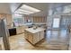 Open-concept kitchen featuring an island, stainless steel appliances, and plenty of counter space with nice flooring at 3821 S Tumbleweed Ave, Pahrump, NV 89048