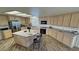 Spacious kitchen with stainless steel appliances, granite countertops, and a large kitchen island with seating at 3821 S Tumbleweed Ave, Pahrump, NV 89048