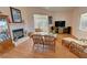 Living room featuring a fireplace, wood floors, and wicker furniture at 3821 S Tumbleweed Ave, Pahrump, NV 89048