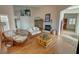 Open living area with hardwood floors, fireplace, and comfortable seating at 3821 S Tumbleweed Ave, Pahrump, NV 89048