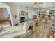 Living room with hardwood floors, a fireplace and view to kitchen at 3821 S Tumbleweed Ave, Pahrump, NV 89048