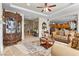 Open floor plan featuring a living room with fireplace flowing into the eat-in kitchen at 4493 Rometta Ave, Las Vegas, NV 89141