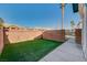 Private backyard with artificial turf and block wall at 5040 Sublight Ave, Las Vegas, NV 89108