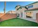 Private backyard with artificial turf and block wall at 5040 Sublight Ave, Las Vegas, NV 89108
