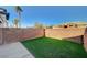Private backyard with artificial turf and block wall at 5040 Sublight Ave, Las Vegas, NV 89108