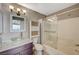 Clean bathroom with granite countertop, glass sink, and shower/tub combo at 5040 Sublight Ave, Las Vegas, NV 89108