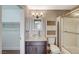 Well-appointed bathroom with shower/tub, granite vanity, and linen cabinet at 5040 Sublight Ave, Las Vegas, NV 89108