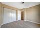 Spacious bedroom with wood-look flooring and double closet at 5040 Sublight Ave, Las Vegas, NV 89108