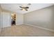 Spacious bedroom with ceiling fan and access to bathroom at 5040 Sublight Ave, Las Vegas, NV 89108