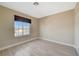 Well-lit bedroom featuring wood-look flooring and large window at 5040 Sublight Ave, Las Vegas, NV 89108