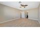 Large bedroom with ceiling fan and en-suite bathroom access at 5040 Sublight Ave, Las Vegas, NV 89108