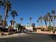 Community entrance with palm trees and gate at 5040 Sublight Ave, Las Vegas, NV 89108