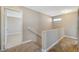 Upstairs hallway with carpeted floors and access to bedrooms at 5040 Sublight Ave, Las Vegas, NV 89108