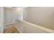 Upstairs hallway with carpet leading to bedrooms at 5040 Sublight Ave, Las Vegas, NV 89108