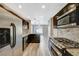 Modern kitchen with stainless steel appliances and granite countertops at 5040 Sublight Ave, Las Vegas, NV 89108